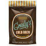 Bag of Grady’s Cold Brew New Orleans-Style Coffee & Chicory, Medium Dark Roast. The 16 oz bag features a brown background with the Grady’s logo in light blue and orange, and a striped top edge in teal, orange, yellow, and brown. Text indicates it’s perfect for hot and cold brewing.