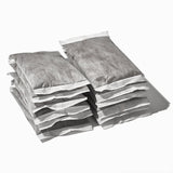 Twelve sealed Grady’s Cold Brew bean bags stacked in two uneven piles on a white background.