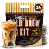 Front-facing product image of Grady’s Cold Brew Kit in a pour-and-store pouch. The package indicates it makes 36 cups and contains bean bags. A glass of iced coffee with milk and ice is shown in front, with stacked bean bags beside the pouch.
