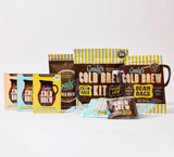 Collection of Grady's Cold Brew products displayed on a white background, including Original, French Vanilla, and Decaf Bean Bag Bundles, New Orleans-Style Coffee & Chicory grounds, the Cold Brew Kit with Store & Pour pouch, Bean Bags, and concentrate packets. The image showcases Grady's full lineup of brew-at-home cold brew coffee products, featuring multiple brewing formats and flavor options.