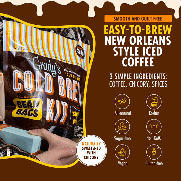 Grady’s Cold Brew Kit pouch resting in someone’s lap like a gift, next to bold text describing it as smooth, guilt free, easy to brew New Orleans style iced coffee made from three ingredients (coffee, chicory, spices) with badges showing it is all natural, kosher, sugar free, non-GMO, vegan, gluten free, and naturally sweetened with chicory.