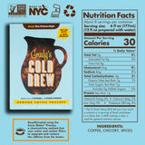 Front of Grady’s Decaf Cold Brew Bean Bag Box shown next to its full Nutrition Facts panel on a light blue background. The box displays the pitcher graphic, product name, and icons for Non-GMO, Made in NYC, Kosher, and recycling. A callout at the bottom explains the Swiss Water decaffeination process. Ingredients listed are coffee, chicory, and spices.