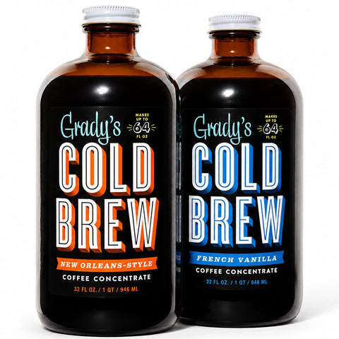 Two 32 oz bottles of Grady’s Cold Brew Coffee Concentrate on a white background featuring New Orleans–Style and French Vanilla flavors side by side.