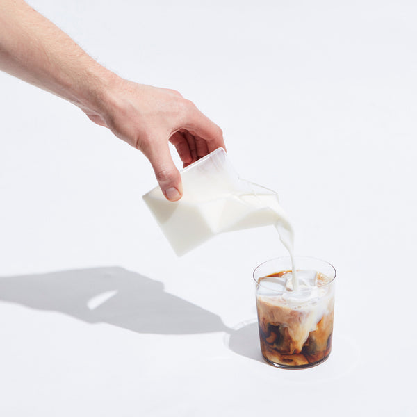 Cold Brew Coffee Concentrate Bag in Box - Grady's Cold Brew - Milk being poured into glass.